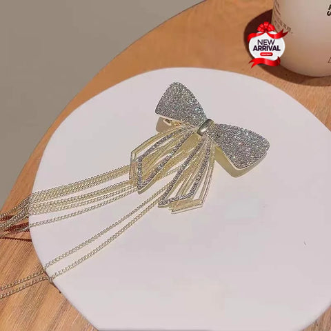 Beautiful Gold & Silver Bow style Hair Clip with hanging tassels