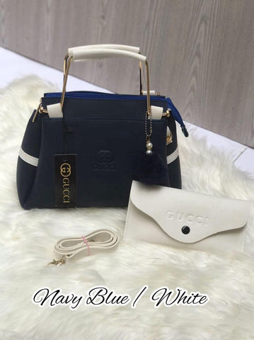 Most Demandable Gucci 2 Piece set. Featuring a long wallet and cute pom pom keychains