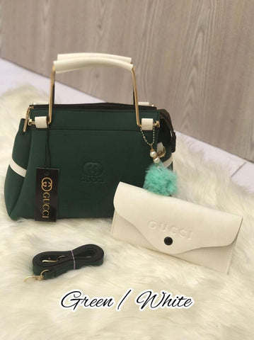Most Demandable Gucci 2 Piece set. Featuring a long wallet and cute pom pom keychains